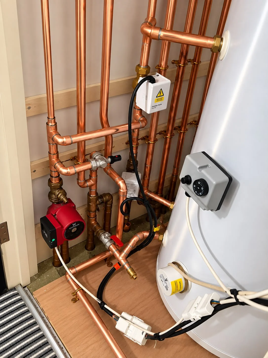 Gas Safe registered engineer working on heating boiler
